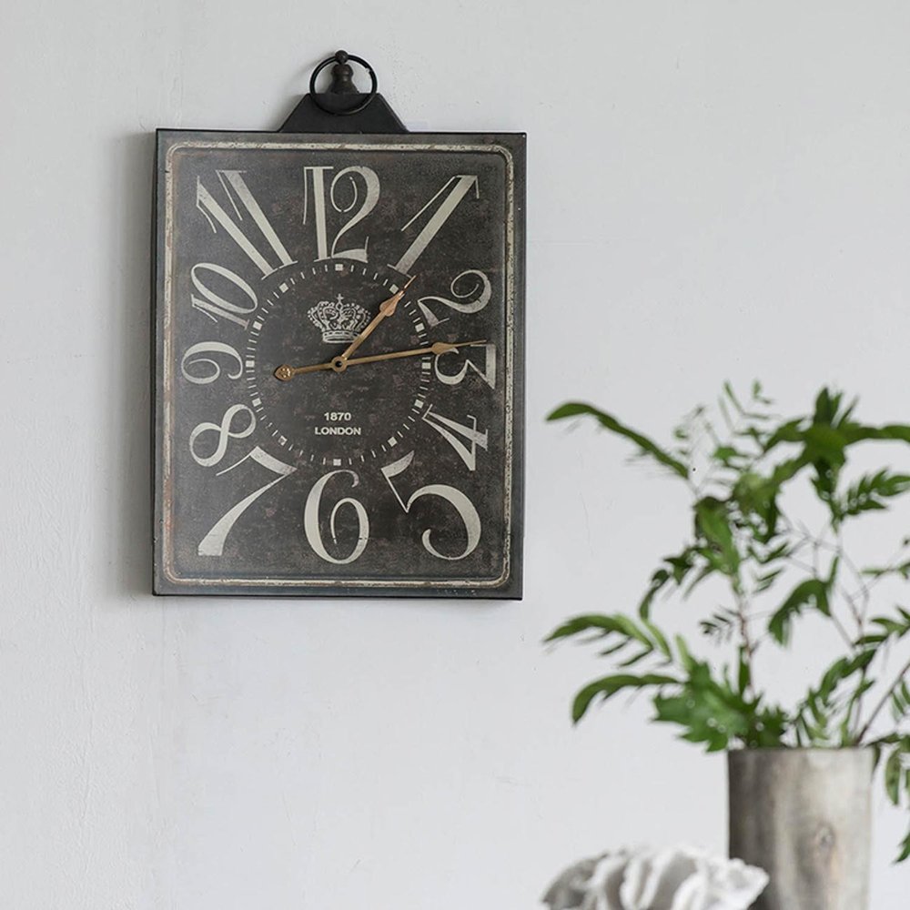 Vintage Style Black and White Iron Wall Clock on a white background