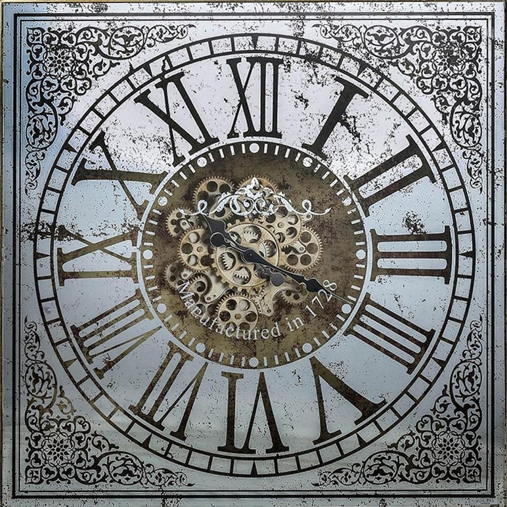 32" Gold And Silver Metal Analog Distressed Square Wall Clock styled in a furnished interior with a gray wall on a tiled floor.