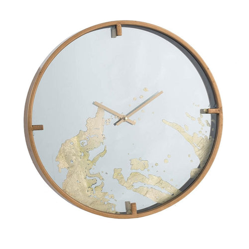 Round analog wall clock with a gold and white abstract design on a mirrored face, framed in wood.