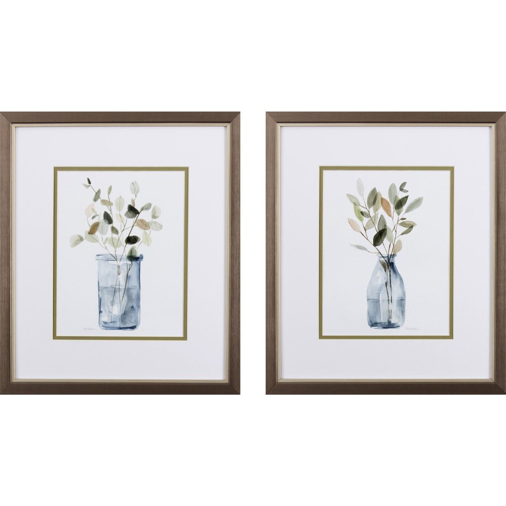 Two framed watercolor paintings of plants in glass vases with neutral colors and a metallic finish frame.