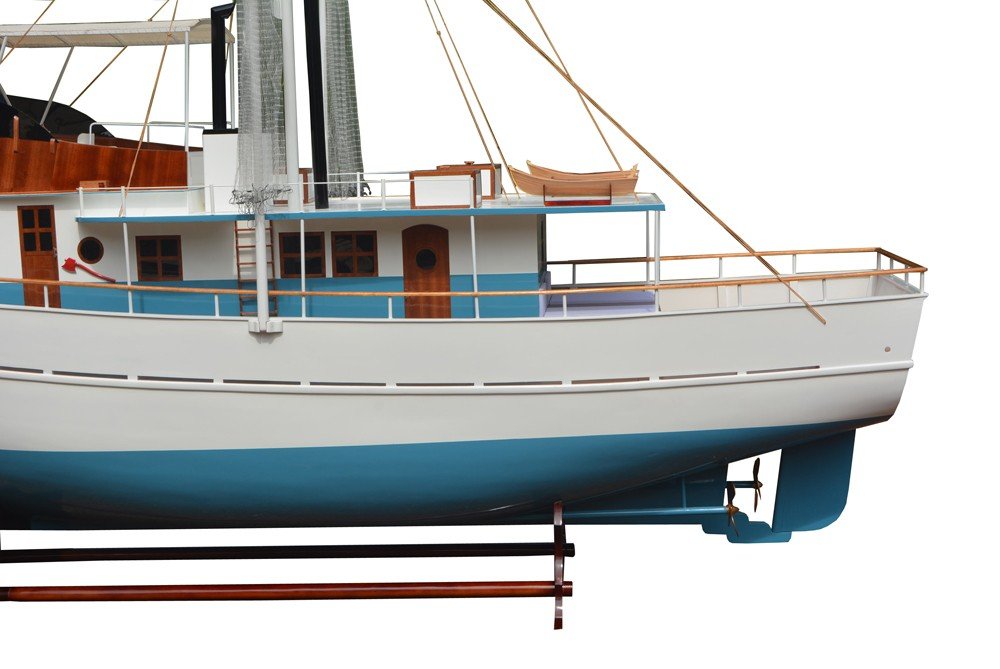110" Blue And White Solid Wood Hand Painted Model Boat. Home product isolated on a plain white background, finished in blue wood.