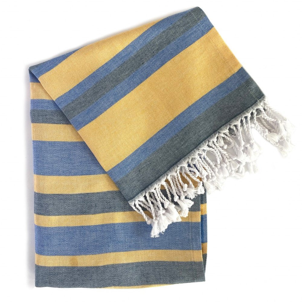 Denim blue and yellow striped Turkish towel with white fringe on a white background.