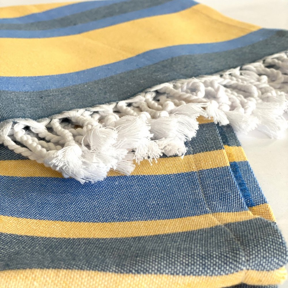 Denim Blue and Yellow Striped Turkish Towel Beach Blanket in a home interior