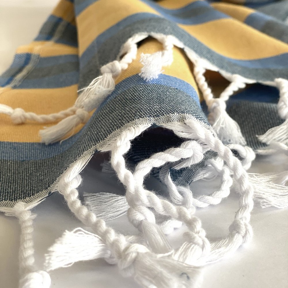 Denim Blue and Yellow Striped Turkish Towel Beach Blanket in a home interior