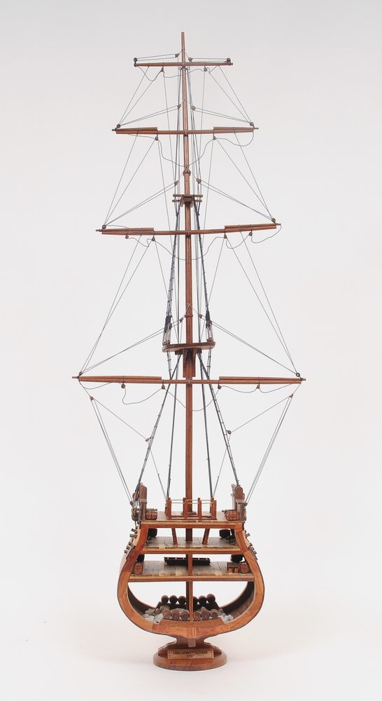 34" Brown Boat Model Sculpture. Sculpture isolated on a plain white background, finished in brown.