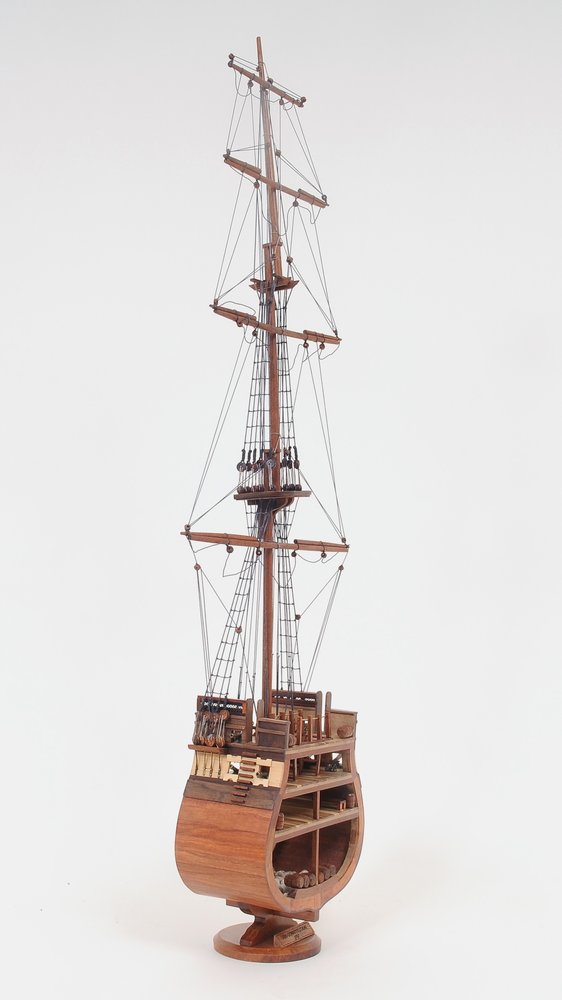 34" Brown Boat Model Sculpture. Sculpture isolated on a plain white background, finished in brown.