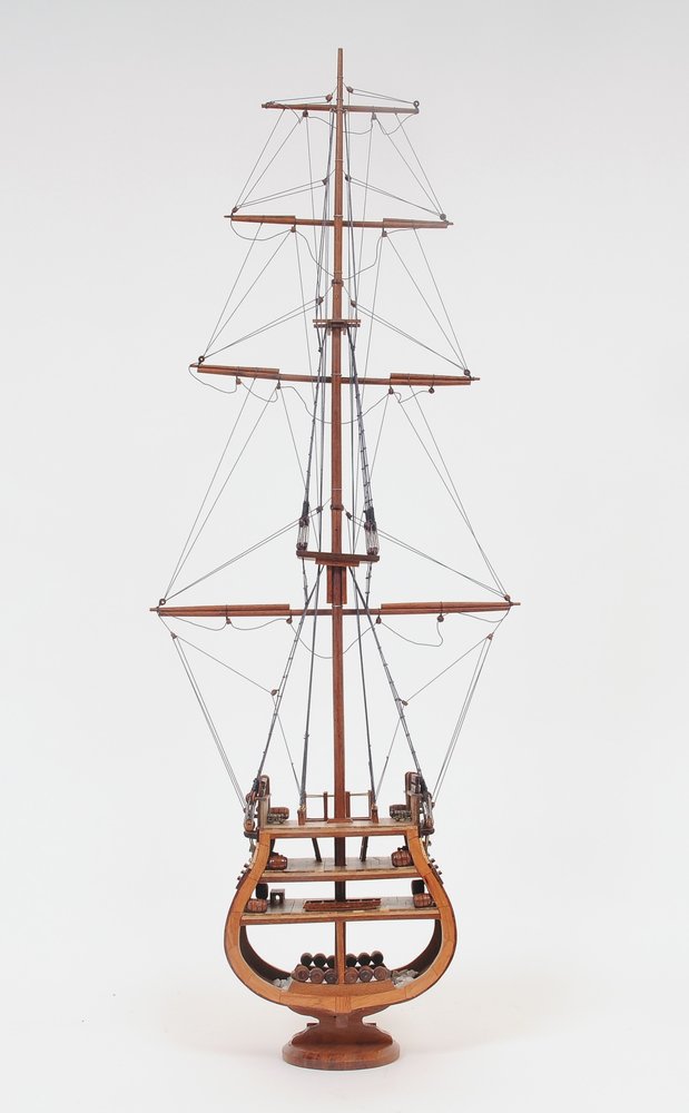 34" Brown Boat Model Sculpture. Sculpture isolated on a plain white background, showing its brown color.