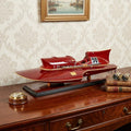 7" Red Manufactured Wood Hand Painted Decorative Boat in a home interior