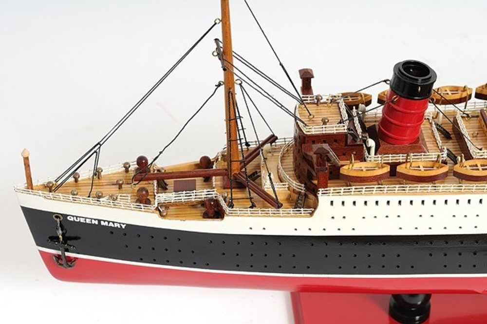 12" Black And Red Solid Wood Hand Painted Boat Model Boat. Home product isolated on a plain white background, showing a black wood surface.