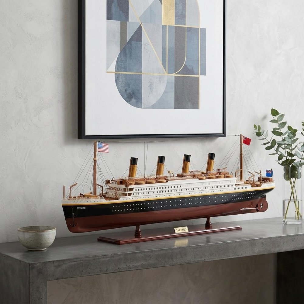14" Black And Red Solid Wood Hand Painted Boat Model Boat styled in a furnished interior with a light gray wall on a charcoal floor.