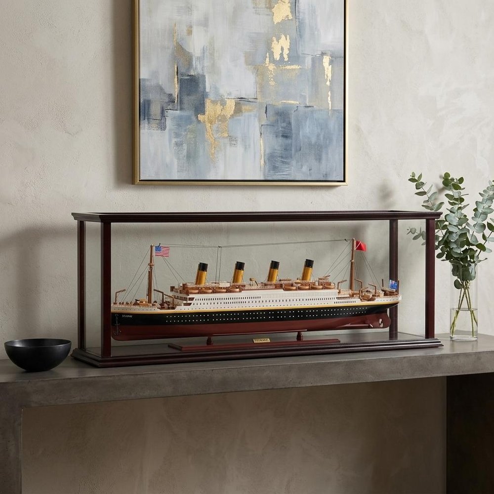 15" Black And Red Solid Wood Hand Painted Boat Model Boat styled in a furnished interior with a light gray wall on a dark wood floor.
