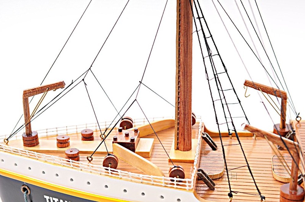 11" Black And Red Solid Wood Hand Painted Boat Model Boat. Home product isolated on a plain white background, showing a wood surface.
