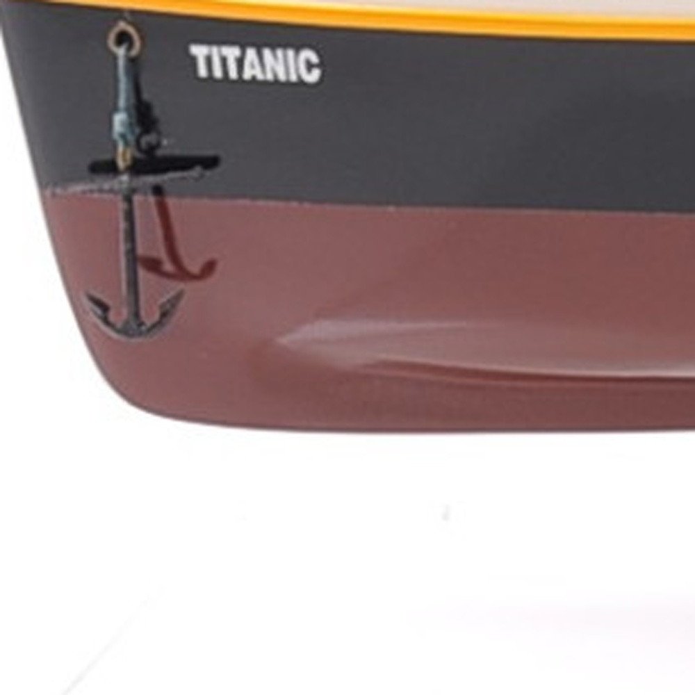 10" Black and Red Solid Wood Hand Painted 1912 RMS Titanic Small Model Boat. Home product isolated on a plain white background, finished in black wood.