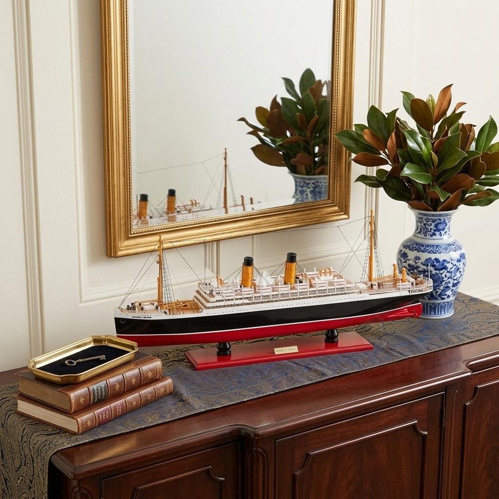 13" Black and Red Solid Wood Hand Painted RMS Empress of Ireland Model Boat styled in a furnished interior with an off-white wall on a black floor.