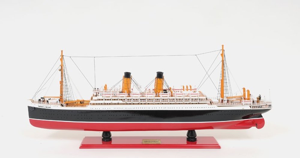 13" Black and Red Solid Wood Hand Painted RMS Empress of Ireland Model Boat. Home product isolated on a plain white background, showing a black wood surface.