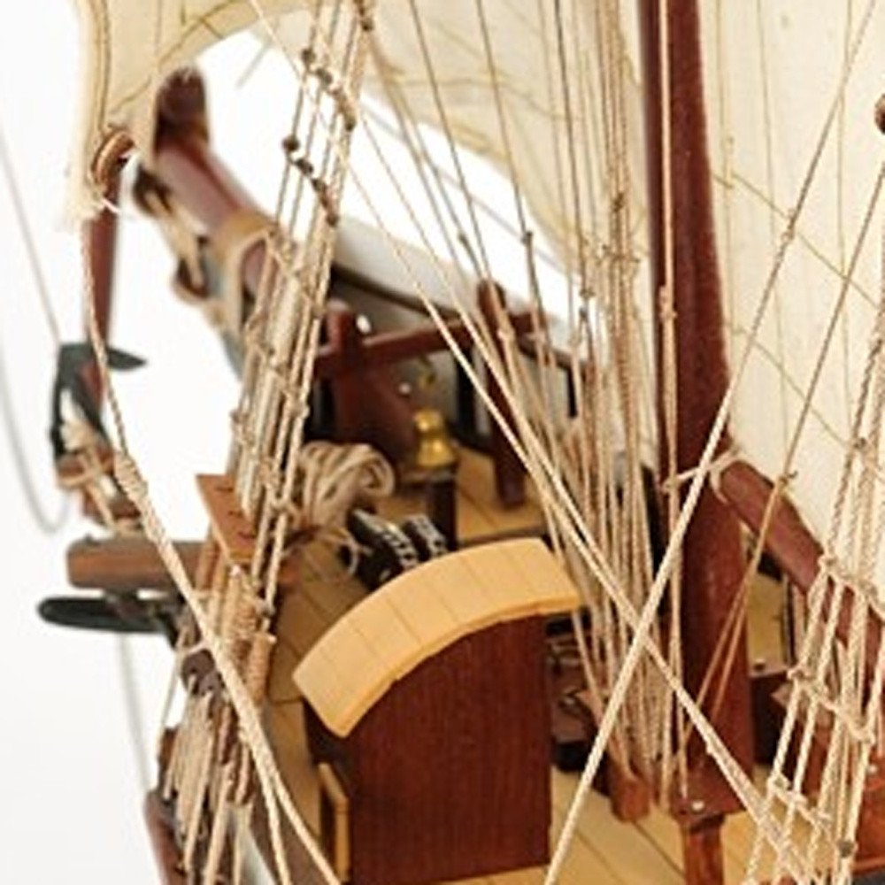 Close-up of 26" Black and White Solid Wood Hand Painted p-Oxybis(benzenesulfonyl hydrazide) Model Boat showing black wood detail.