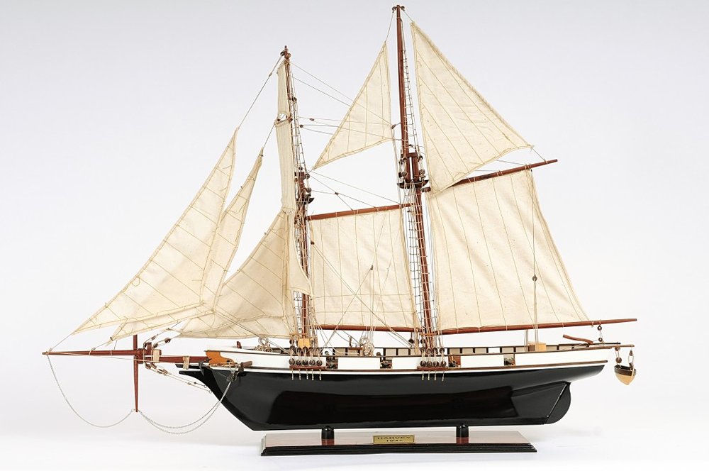 26" Black and White Solid Wood Hand Painted p-Oxybis(benzenesulfonyl hydrazide) Model Boat. Home product isolated on a plain white background, showing a white wood surface.