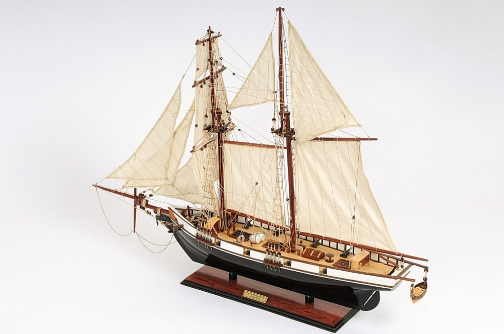 26" Black and White Solid Wood Hand Painted p-Oxybis(benzenesulfonyl hydrazide) Model Boat. Home product isolated on a plain white background, in a white wood finish.