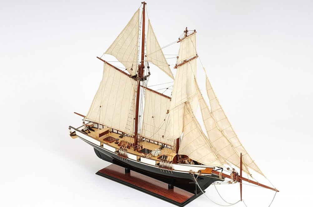 26" Black and White Solid Wood Hand Painted p-Oxybis(benzenesulfonyl hydrazide) Model Boat. Home product isolated on a plain white background, in a white wood finish.