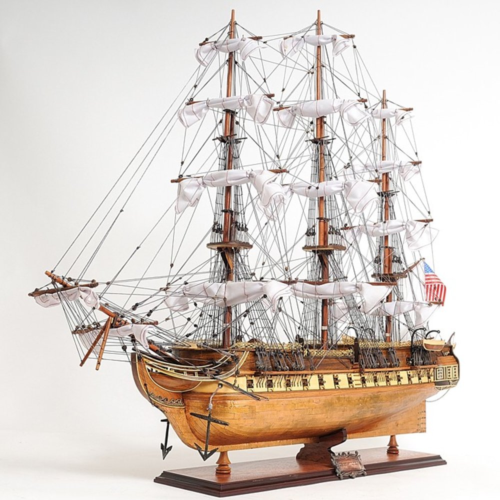 32" Brown Solid Wood Hand Painted Boat Model Boat. Home product isolated on a plain white background, showing a brown wood surface.