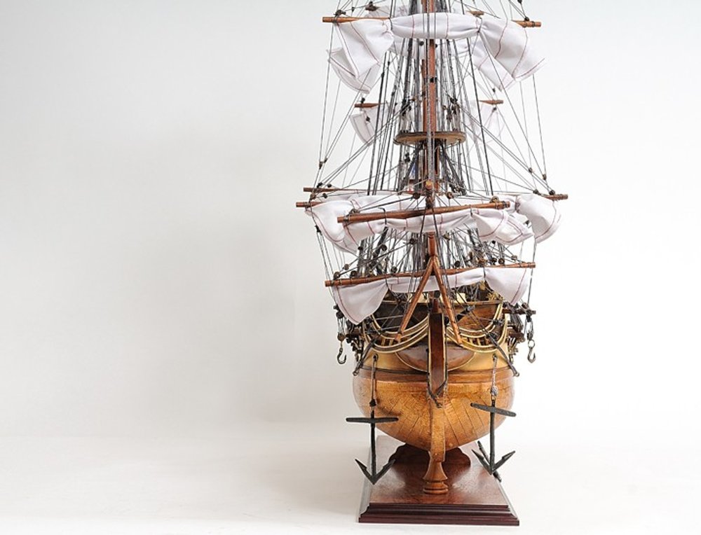 32" Brown Solid Wood Hand Painted Boat Model Boat. Home product isolated on a plain white background, showing a wood surface.