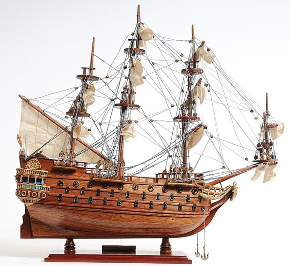 18" Wood Brown Solid Wood Hand Painted San Felipe 1690 Small Model Boat. Home product isolated on a plain white background, finished in brown wood.