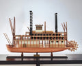 17" Wood Brown Solid Wood Hand Painted King of Mississippi Model Boat shown outdoors on an outdoor setting.