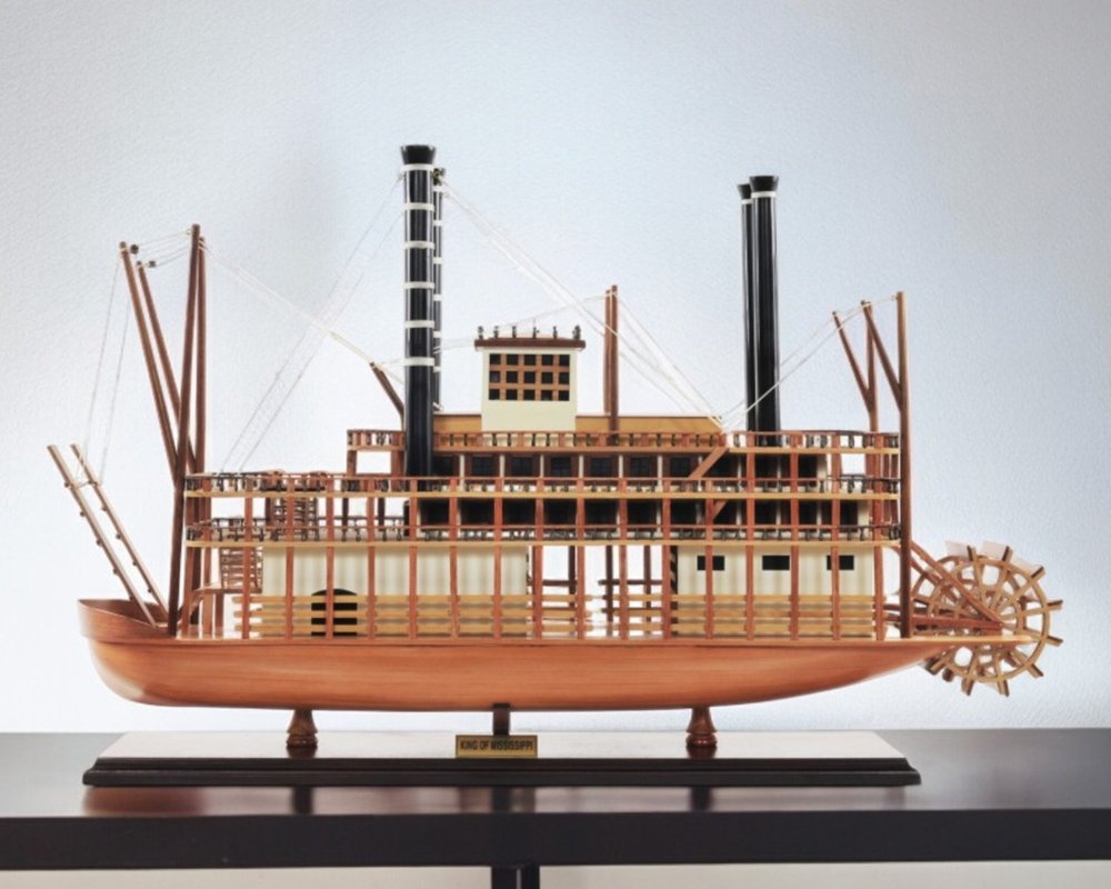 17" Wood Brown Solid Wood Hand Painted King of Mississippi Model Boat shown outdoors on an outdoor setting.