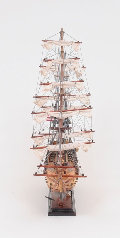 20" Wood Brown Solid Wood Hand Painted 1797 USS Constitution Small Model Boat. Home product isolated on a plain white background, in a brown wood finish.
