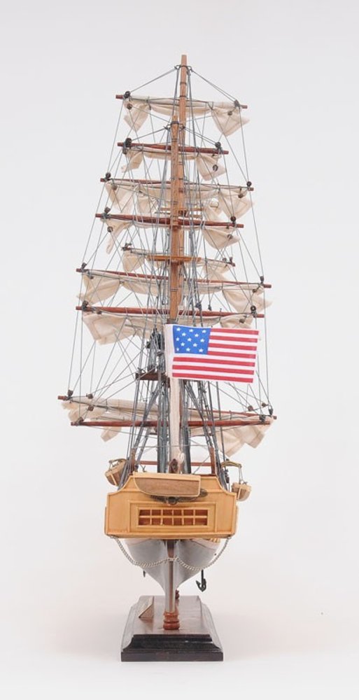 20" Wood Brown Solid Wood Hand Painted 1797 USS Constitution Small Model Boat. Home product isolated on a plain white background, showing a brown wood surface.