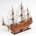 32" Wood Brown Solid Wood Hand Painted c1665 Zeven Provincien Model Boat. Sculpture isolated on a plain white background, finished in brown wood.