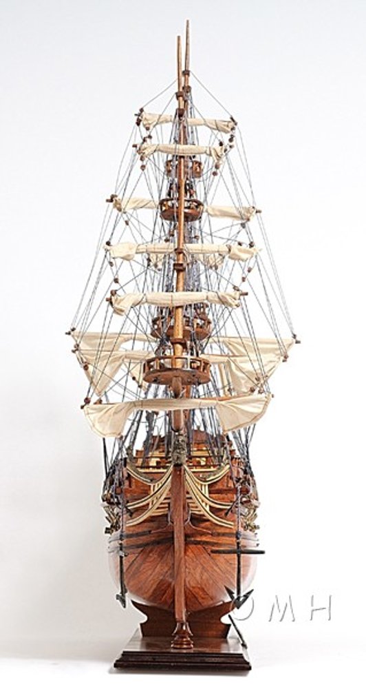 32" Wood Brown Solid Wood Hand Painted c1665 Zeven Provincien Model Boat. Sculpture isolated on a plain white background, showing a brown wood surface.
