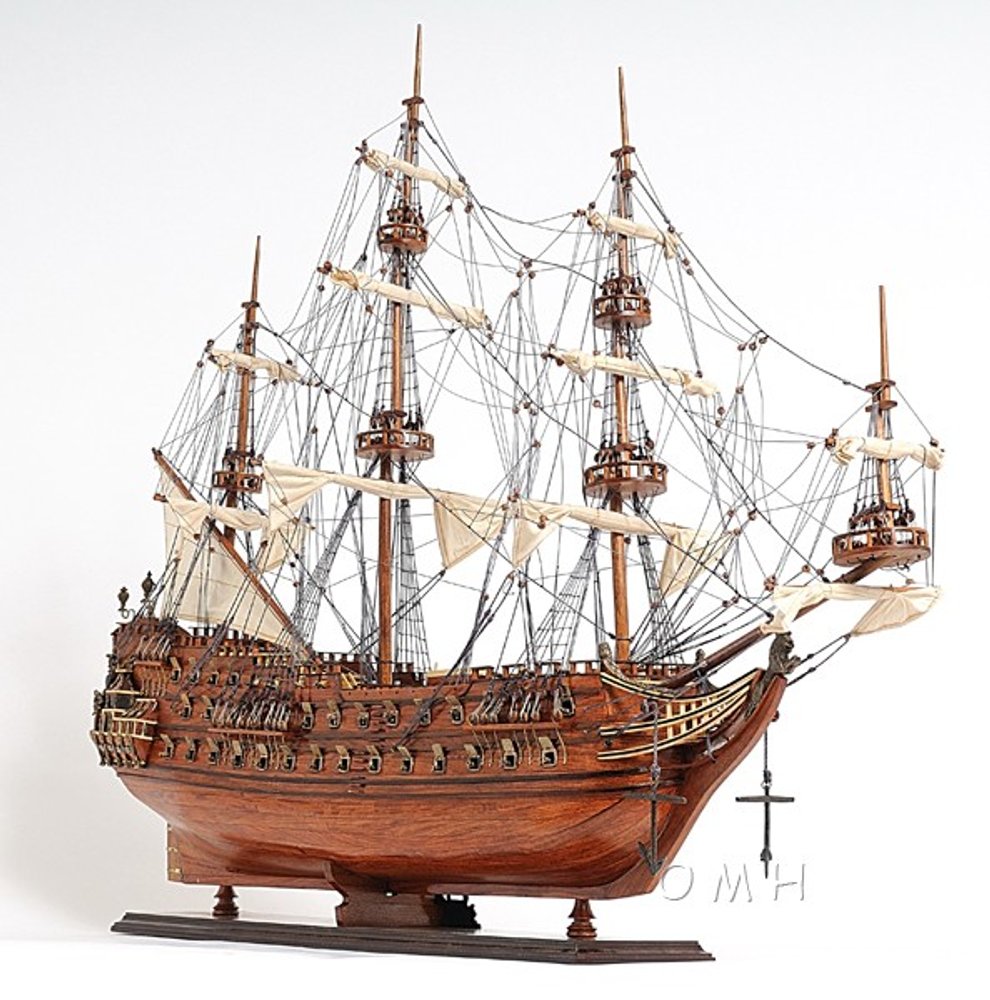 32" Wood Brown Solid Wood Hand Painted c1665 Zeven Provincien Model Boat. Sculpture isolated on a plain white background, showing a brown wood surface.