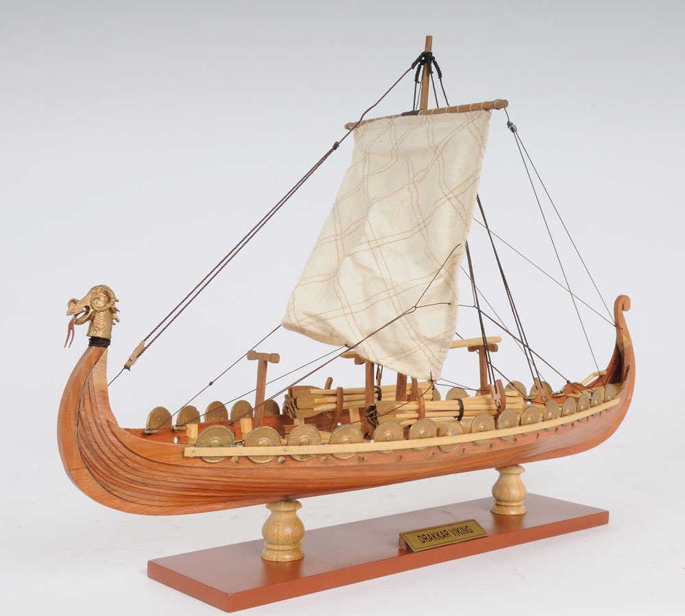 13" Wood Brown Solid Wood Hand Painted Model Boat Tabletop Sculpture. Sculpture isolated on a plain white background, showing a wood surface.