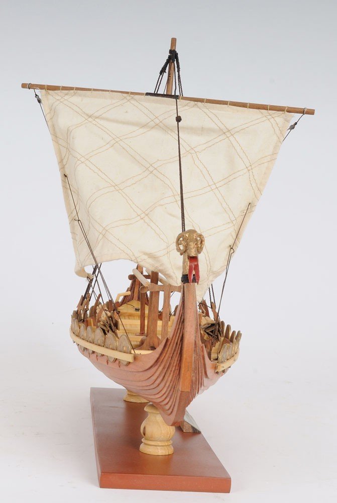 13" Wood Brown Solid Wood Hand Painted Model Boat Tabletop Sculpture. Sculpture isolated on a plain white background, showing a wood surface.