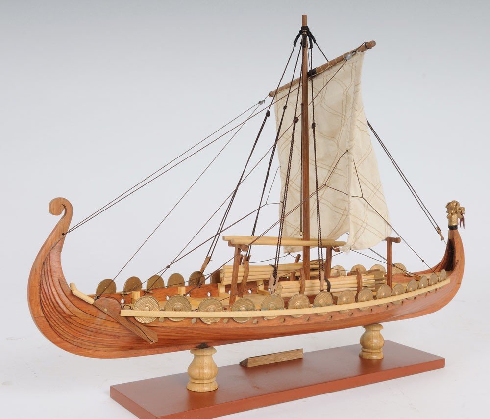13" Wood Brown Solid Wood Hand Painted Model Boat Tabletop Sculpture. Sculpture isolated on a plain white background, showing a brown wood surface.