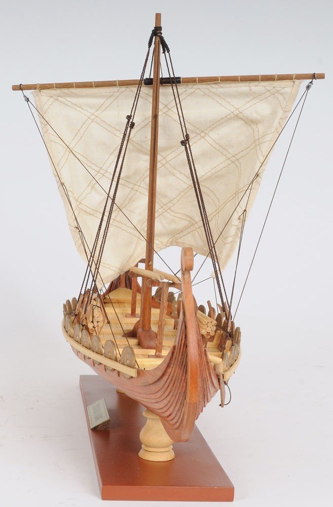 13" Wood Brown Solid Wood Hand Painted Model Boat Tabletop Sculpture. Sculpture isolated on a plain white background, showing a brown wood surface.