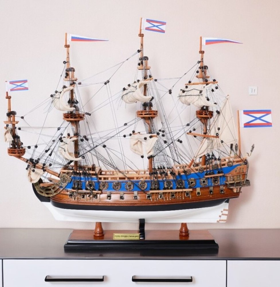 22" Blue and Brown Solid Wood Hand Painted 1700 Goto Predestination Medium Model Boat. Home product isolated on a plain white background, showing a wood surface.