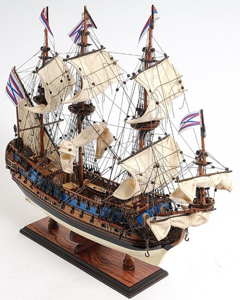 22" Blue and Brown Solid Wood Hand Painted 1700 Goto Predestination Medium Model Boat. Home product isolated on a plain white background, finished in brown wood.