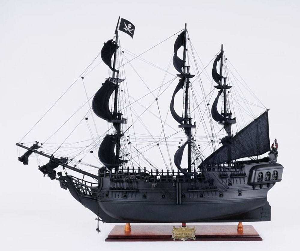 24" Black Solid Wood Hand Painted Model Boat Tabletop Sculpture. Sculpture isolated on a plain white background, finished in black wood.