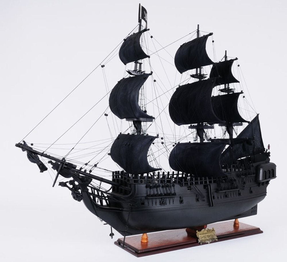 24" Black Solid Wood Hand Painted Model Boat Tabletop Sculpture. Sculpture isolated on a plain white background, showing a black wood surface.