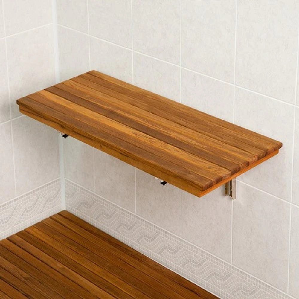 30" Brown Premium Wall Mount Teak Shower Bench styled in a furnished interior with an off-white wall on a dark wood floor.