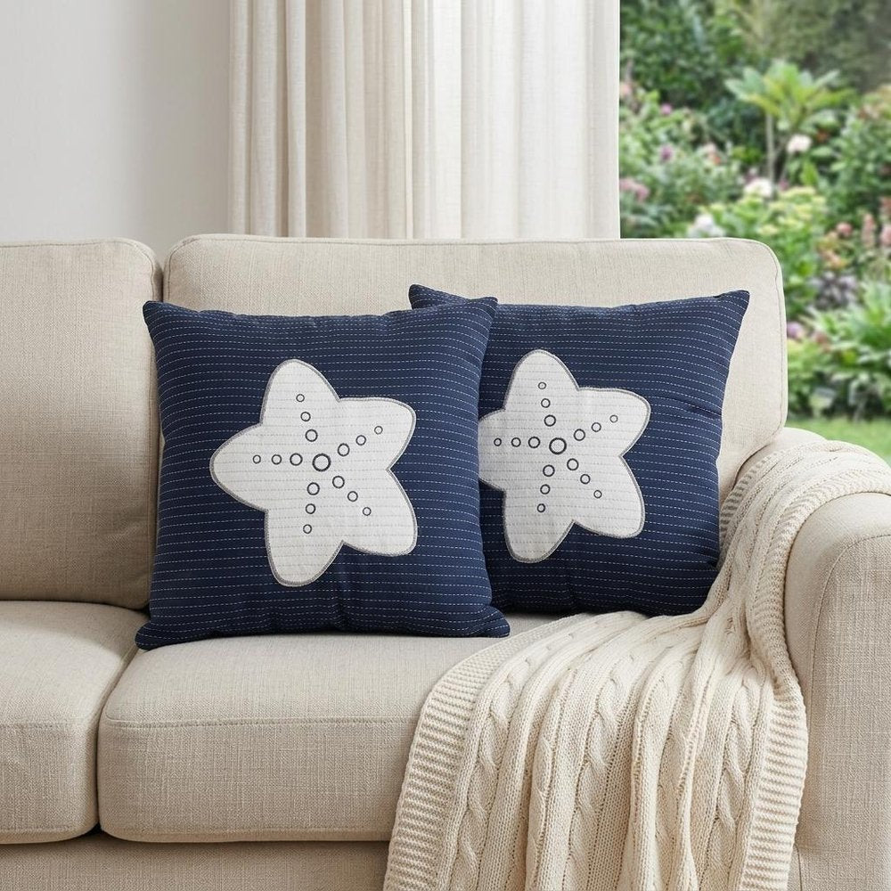 Set of Two Blue and White Starfish Throw Pillows in a home interior