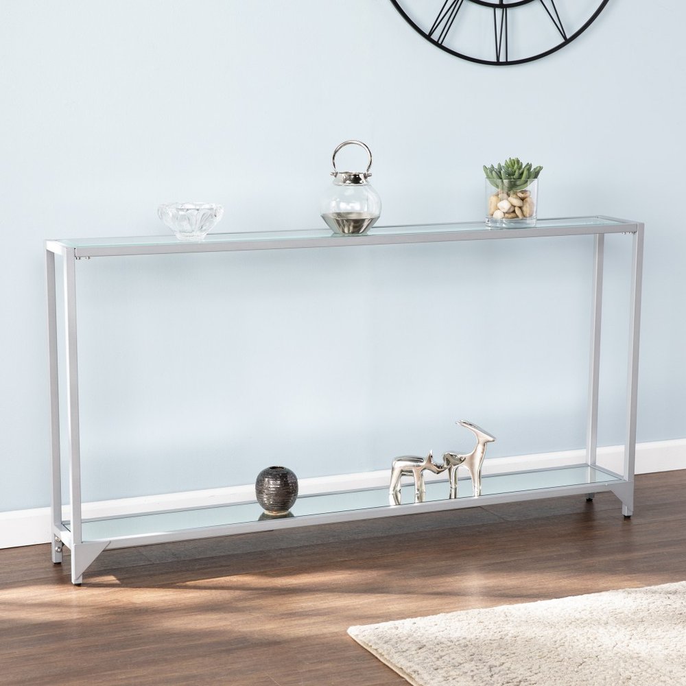 56" Clear and Silver Glass Mirrored Floor Shelf Console Table With Storage shown outdoors on an outdoor setting.