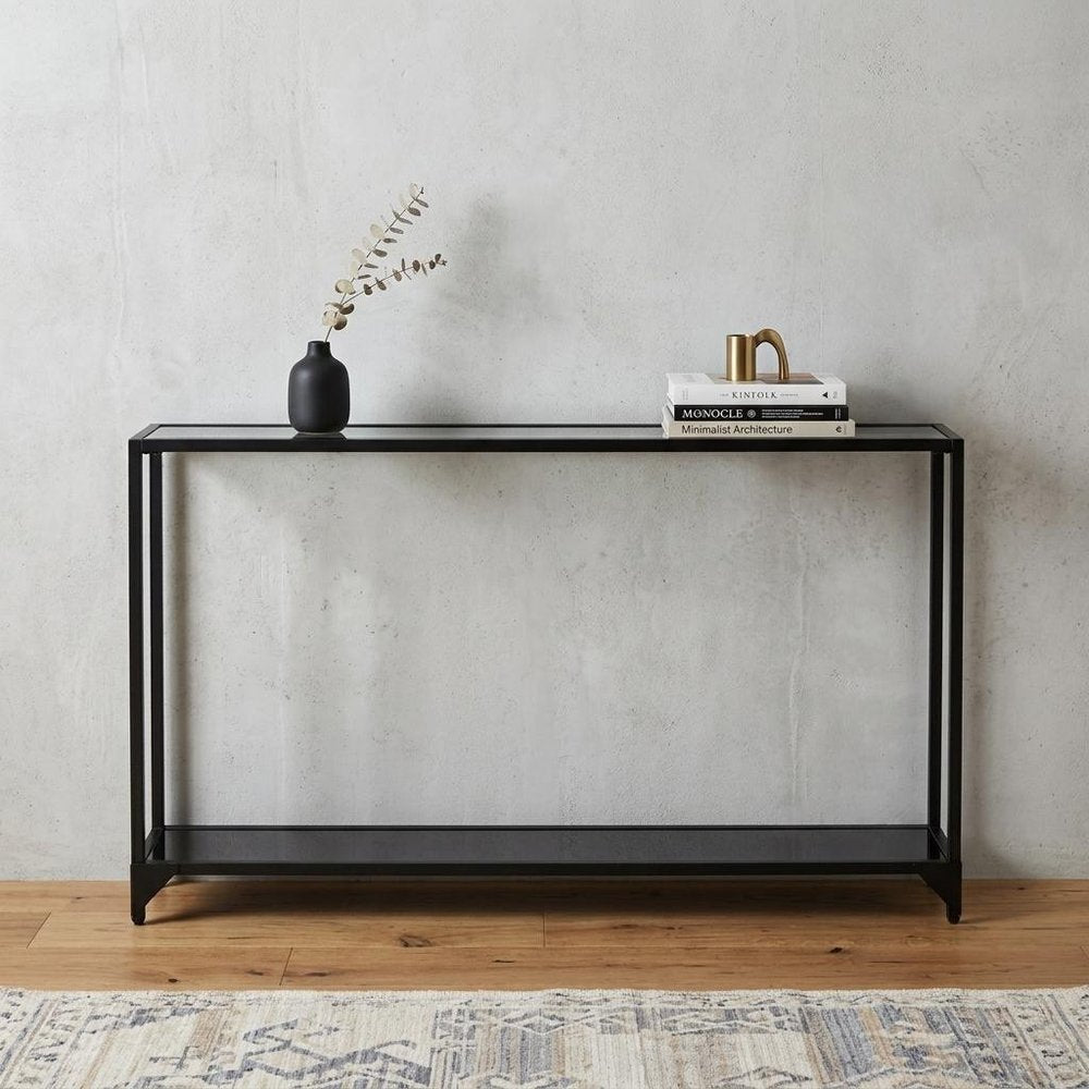 56" Clear and Black Glass Frame Console Table With Shelves. Console table isolated on a plain white background, in a clear glass finish.