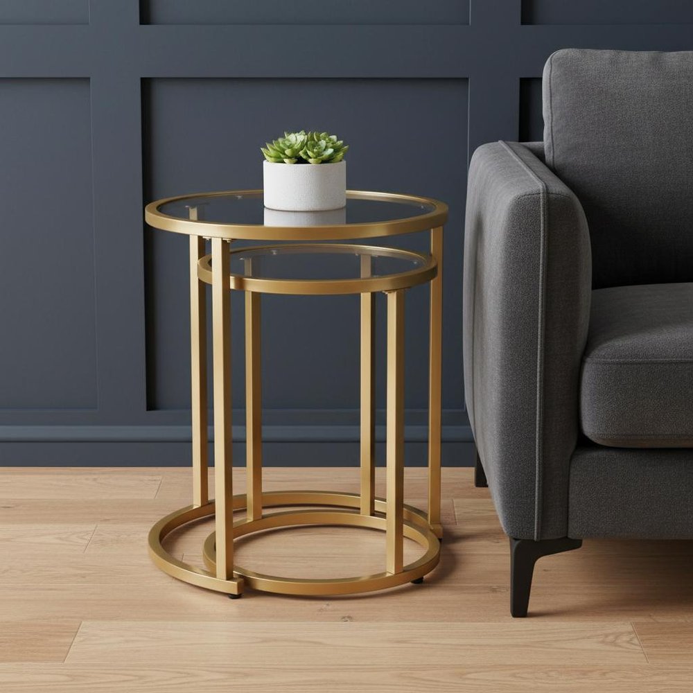 Set Of Two 23" Gold Glass And Steel Round Nested Tables in a home interior