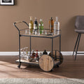 Natural and Black Iron And Reclaimed Wood Rolling Bar Cart With Wine Storage in a home interior