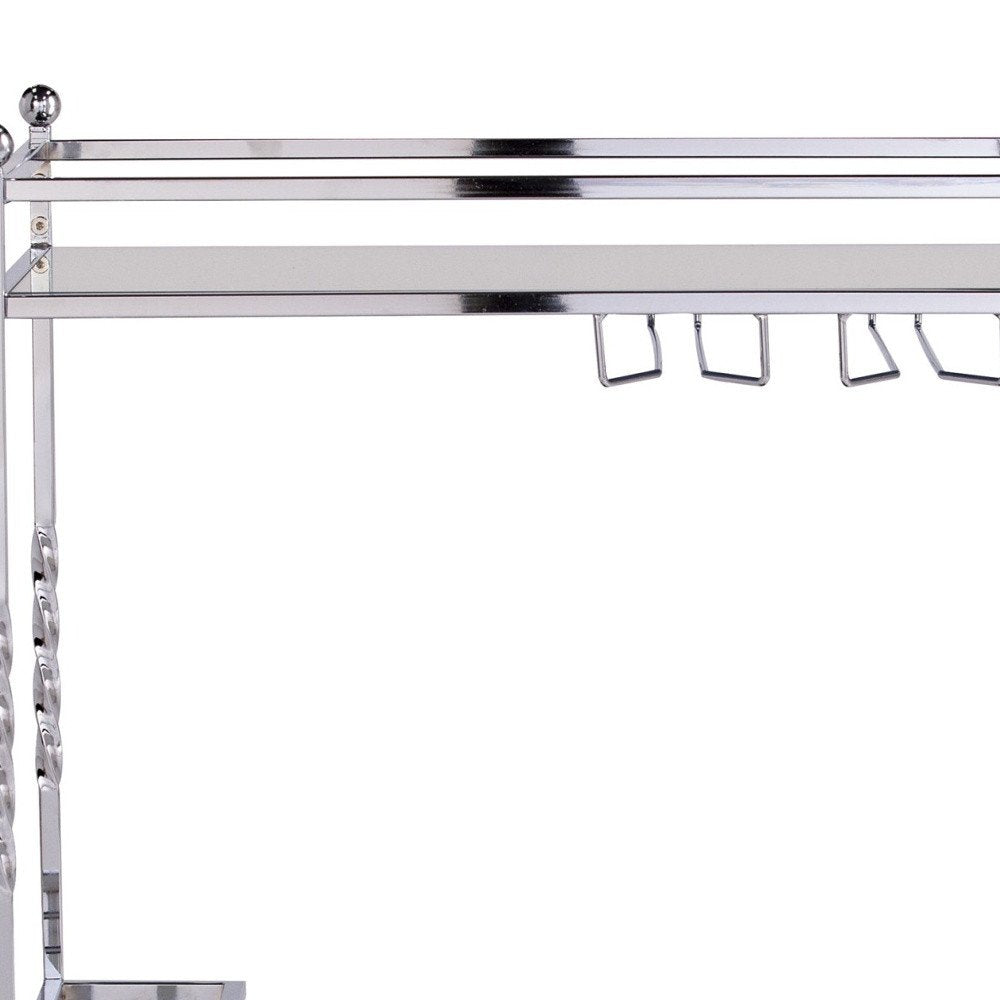 29" Silver Metal and Mirrored Glass Rolling Bar Cart With Wine Storage. Bar cart isolated on a plain white background, showing a silver glass surface.