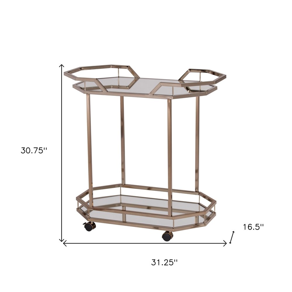 31" Champagne Iron and Mirrored Glass Octagonal Rolling Bar Cart. Bar cart isolated on a plain white background, showing a light gray glass surface.