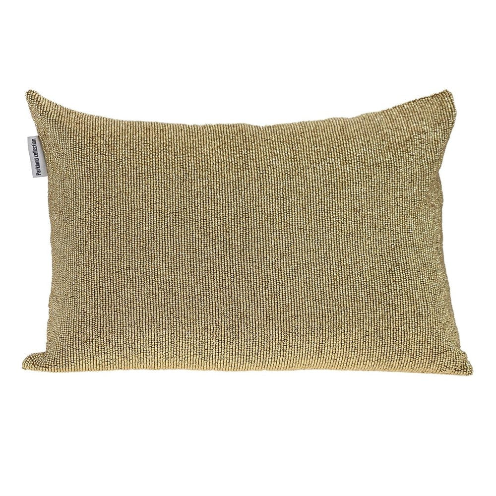 A rectangular throw pillow with a shimmering metallic gold beaded finish on a white background.